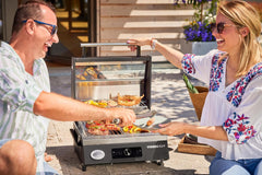 RÖSLE Elektrogrill BBQ-Portable Videro E2-P, tragbarer Tischgrill mit 2 Brennern, Warmhalterost und Deckel mit Glaseinsatz, pulverbeschichteter Stahl, schwarz/silbern